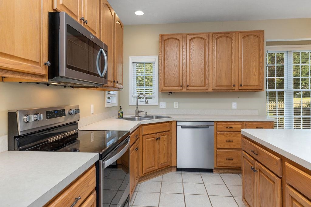 30 Sir Robin Road Waynesboro, VA 22980 - Photo 6 of 62 a kitchen with stainless steel appliances granite countertop a sink stove and microwave