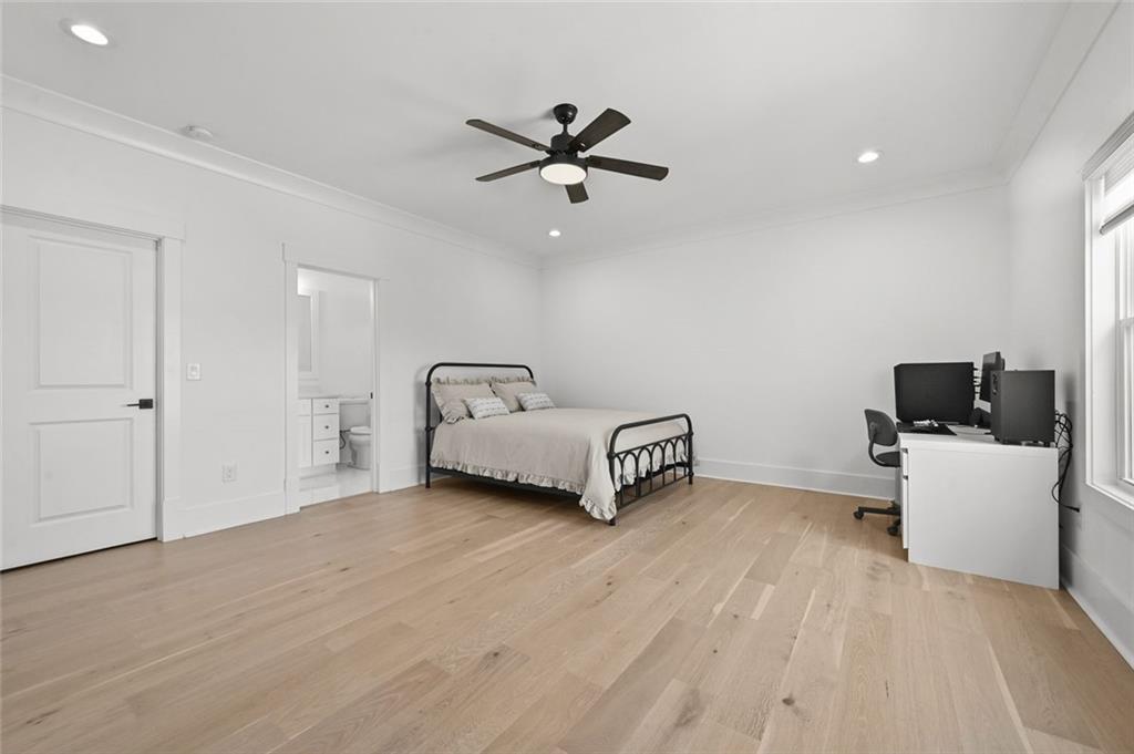 2694 Thompson Mill Road Buford, GA 30519 - Photo 46 of 70 a living room with furniture and a ceiling fan