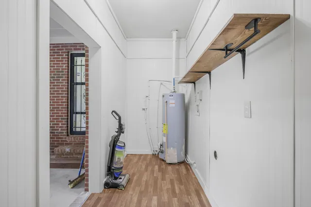 a view of a room with wooden floor and stairs