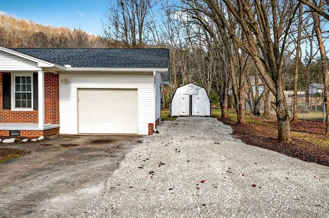 a view of back yard of a house