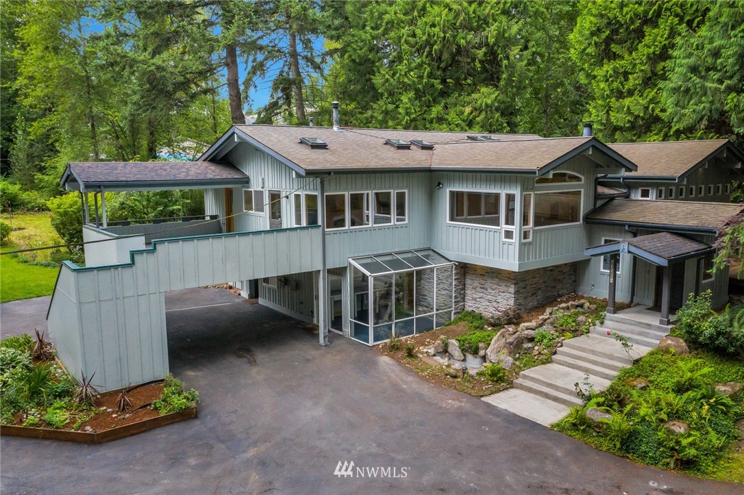 23304 35th Avenue Southeast Bothell, WA 98021 - Photo 1 of 34 a view of a house with a garden and pathway