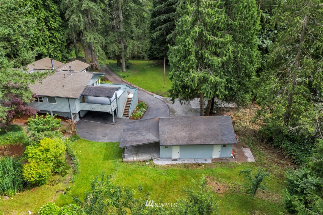 23304 35th Avenue Southeast Bothell, WA 98021 - Photo 2 of 34 an aerial view of a house with swimming pool and garden