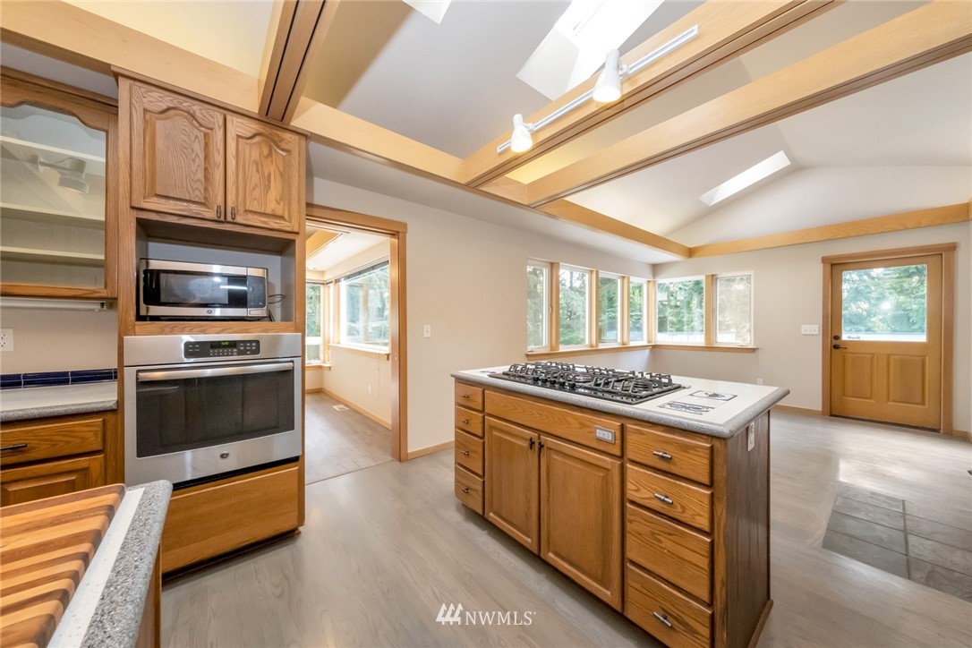 23304 35th Avenue Southeast Bothell, WA 98021 - Photo 11 of 34 a kitchen with stainless steel appliances granite countertop a stove and a sink