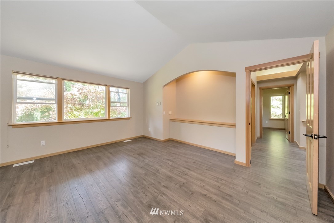 23304 35th Avenue Southeast Bothell, WA 98021 - Photo 16 of 34 an empty room with wooden floor and windows