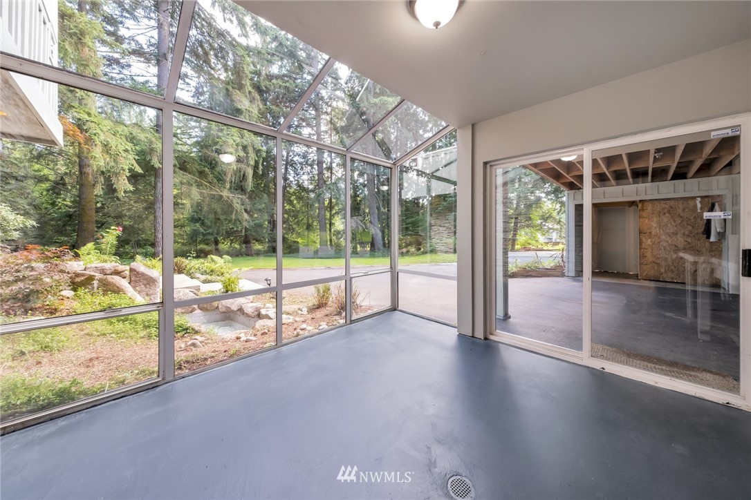 23304 35th Avenue Southeast Bothell, WA 98021 - Photo 22 of 34 a view of empty room with wooden floor and floor to ceiling window