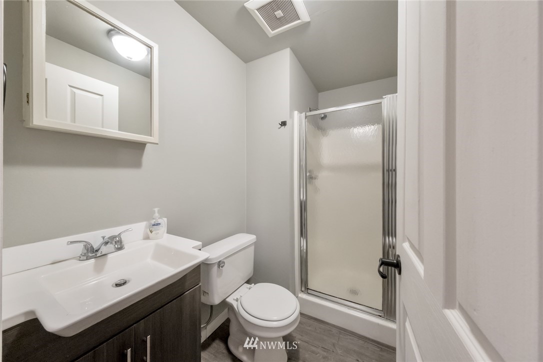 23304 35th Avenue Southeast Bothell, WA 98021 - Photo 25 of 34 a bathroom with a sink toilet and a mirror