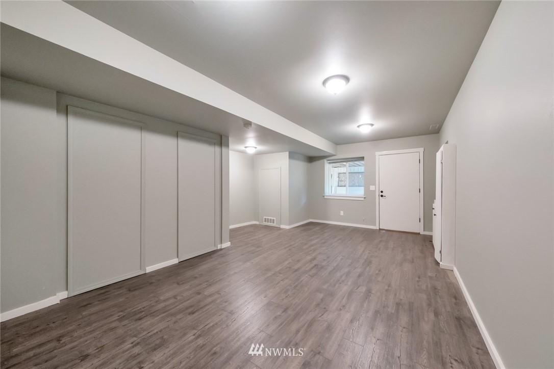 23304 35th Avenue Southeast Bothell, WA 98021 - Photo 28 of 34 a view of empty room with wooden floor