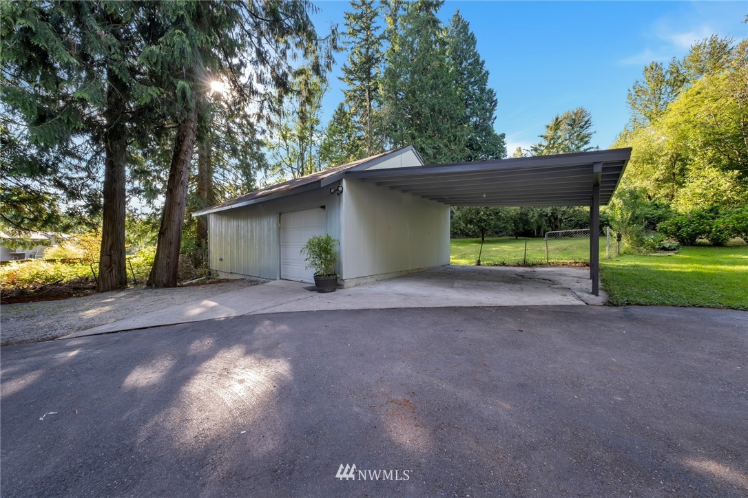 23304 35th Avenue Southeast Bothell, WA 98021 - Photo 32 of 34 a view of a house with a yard and large trees