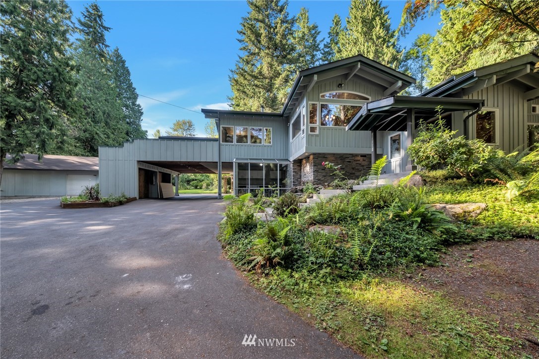 23304 35th Avenue Southeast Bothell, WA 98021 - Photo 34 of 34 a front view of a house with a yard and garage