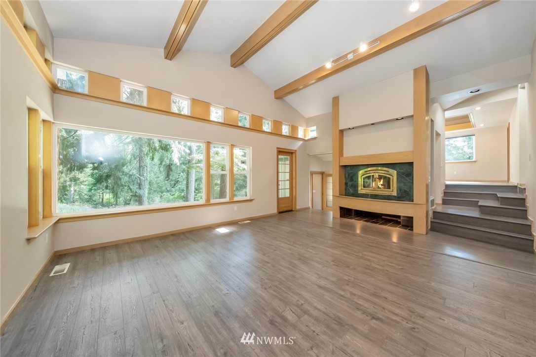 23304 35th Avenue Southeast Bothell, WA 98021 - Photo 6 of 34 a view of a livingroom with wooden floor and a window