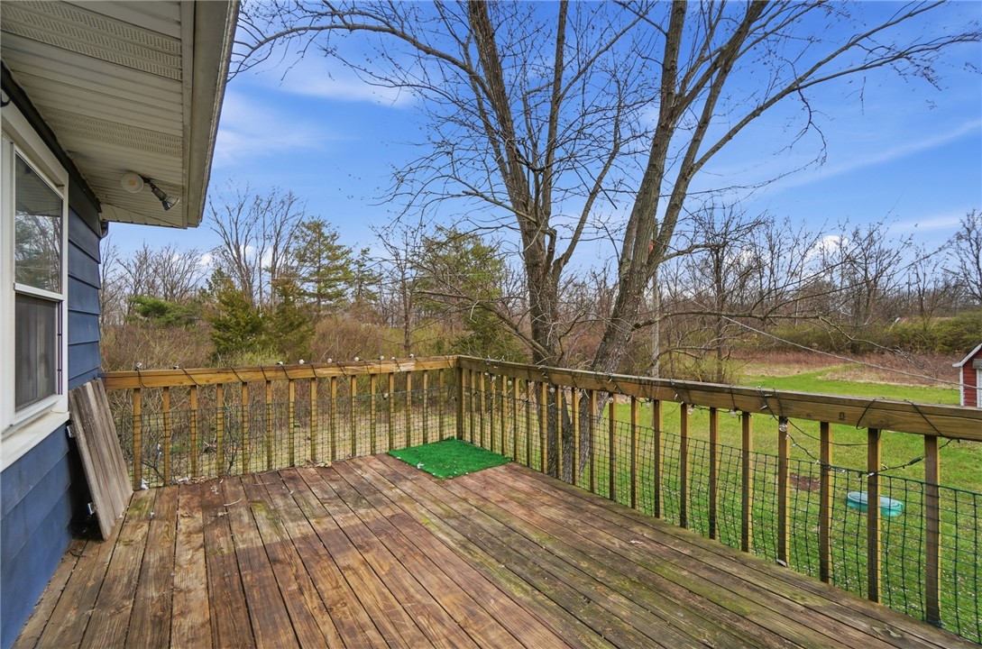 290 Ginghamsburg Road Tipp City, OH 45371 - Photo 39 of 49 Enjoy outdoor living on this elevated deck overlooking serene natural surroundings.