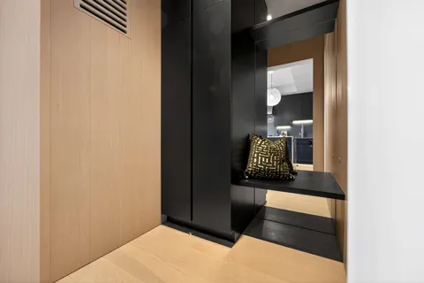 a bedroom with a bed and a night stand