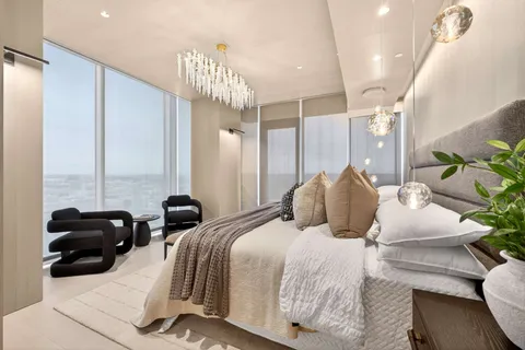 a view of a glass door with a view of living room