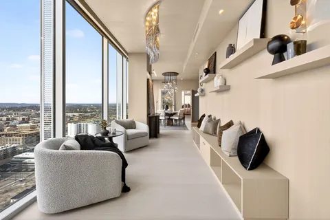 a view of a livingroom with furniture and a chandelier