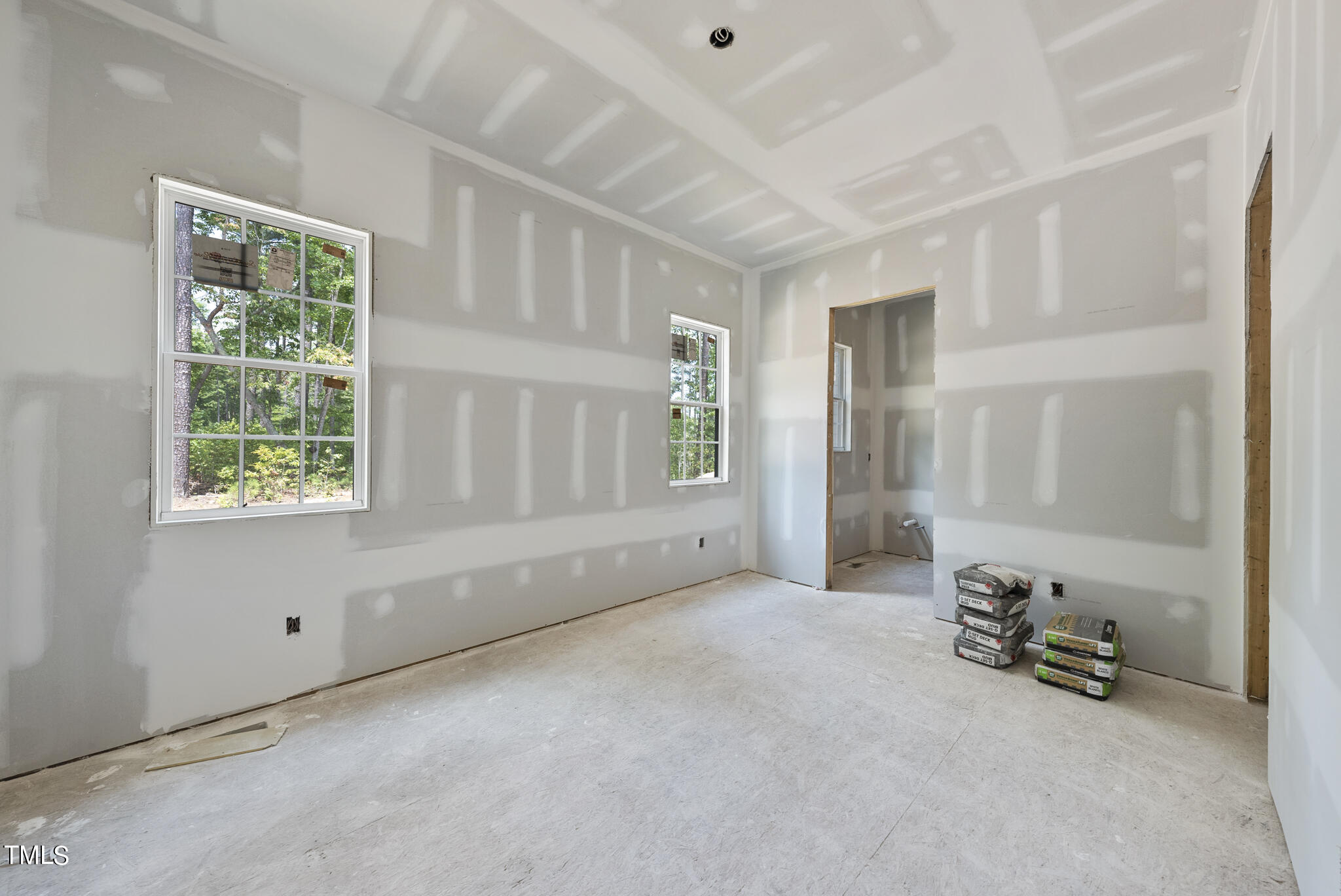 1420 Starry Night Court Raleigh, NC 27613 - Photo 16 of 33 a view of a room with furniture and a window