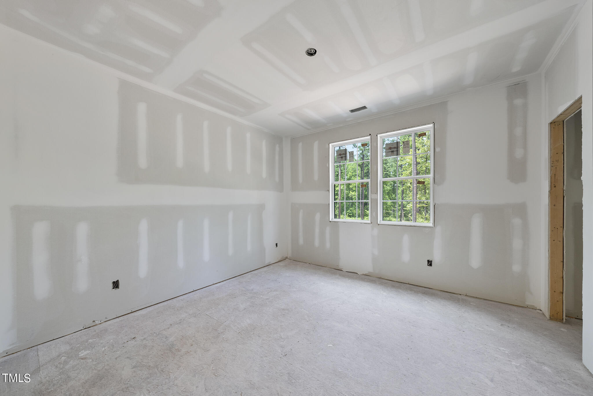 1420 Starry Night Court Raleigh, NC 27613 - Photo 27 of 33 an empty room with windows