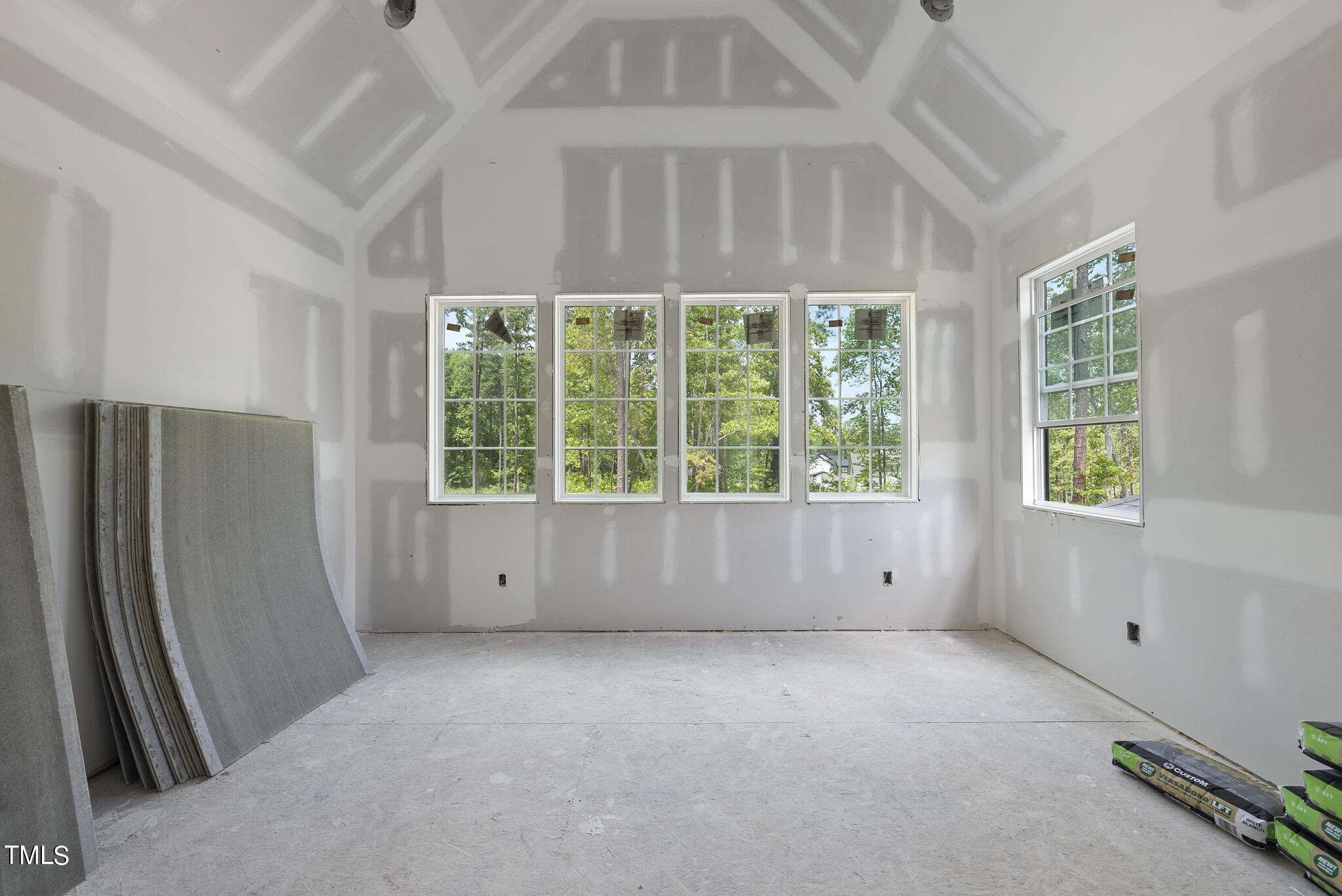 1420 Starry Night Court Raleigh, NC 27613 - Photo 29 of 33 an empty room with a window and a refrigerator