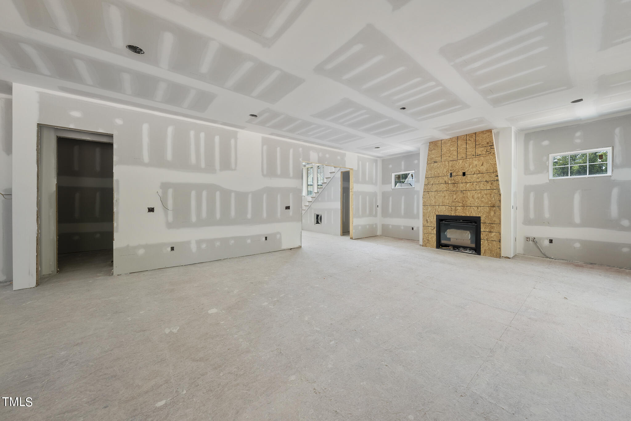 1420 Starry Night Court Raleigh, NC 27613 - Photo 10 of 33 a view of an empty room with a fireplace