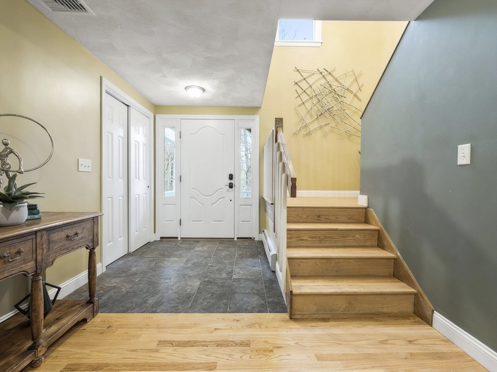 50 Bare Hill Road Topsfield, MA 01983 - Photo 3 of 42 a view of an entryway with wooden floor and a sink