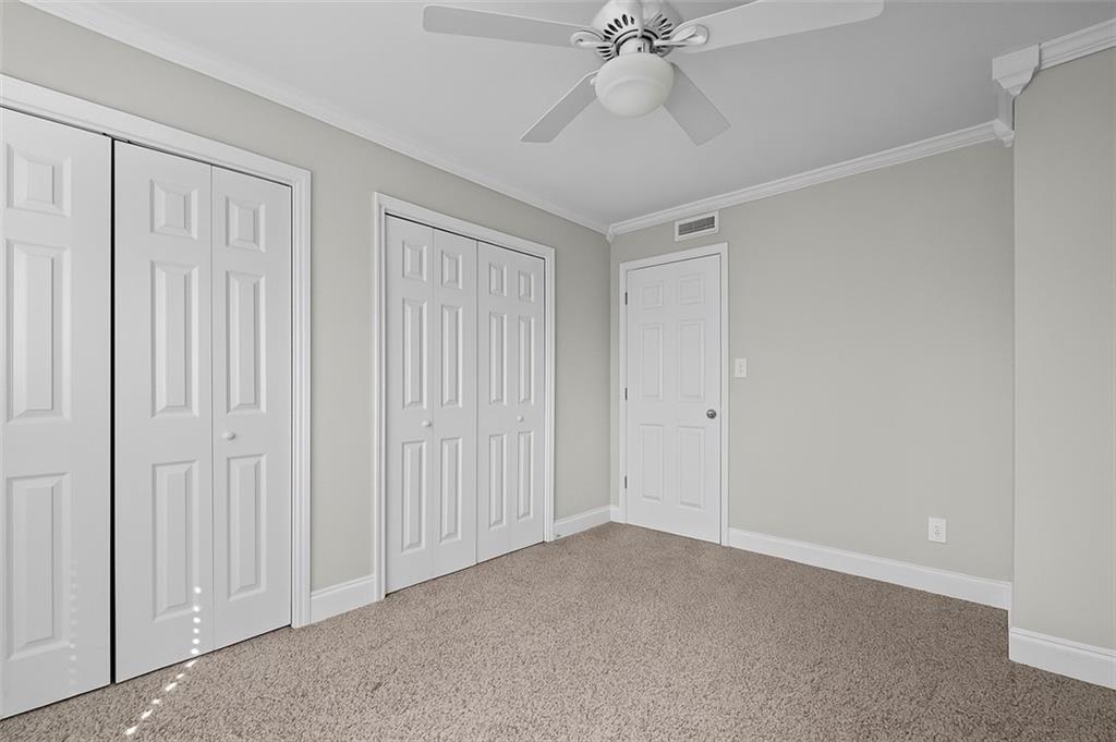 6980 Roswell Road, Unit A8 Atlanta, GA 30328 - Photo 18 of 26 wooden floor in an empty room