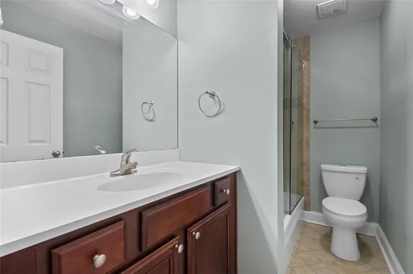 a bathroom with a sink toilet and vanity