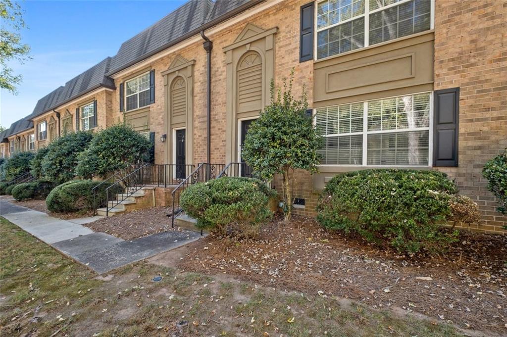 6980 Roswell Road, Unit A8 Atlanta, GA 30328 - Photo 21 of 26 a view of a house with backyard and garden
