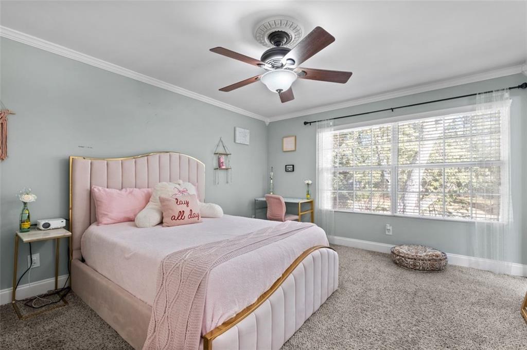 6980 Roswell Road, Unit A8 Atlanta, GA 30328 - Photo 9 of 26 a bedroom with a bed and window