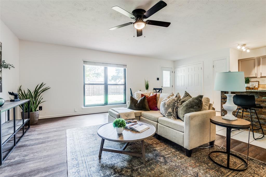 5229 Arbor Glen Road The Colony, TX 75056 - Photo 1 of 1 a living room with furniture potted plant and a window