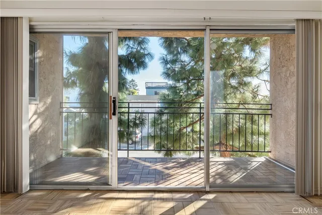 a view of a porch with a floor to ceiling window