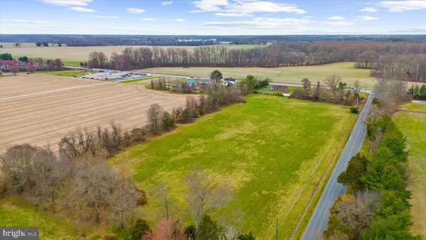 a view of a swimming pool and an outdoor seating