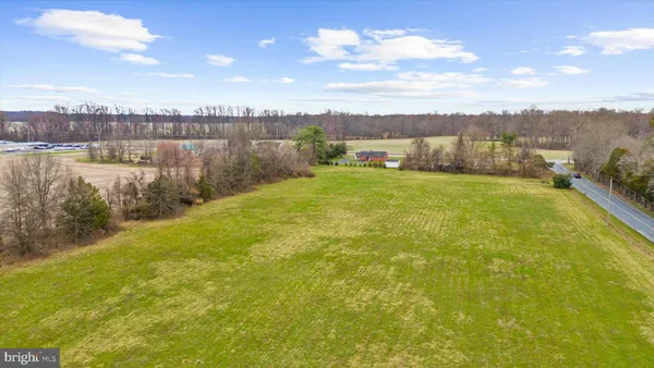 a view of a lake with houses in the background