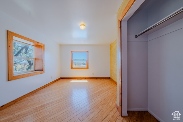 6178 East Zion Road Kanab, UT 84741 - Photo 33 of 48 Unfurnished bedroom with wood finished floors and baseboards
