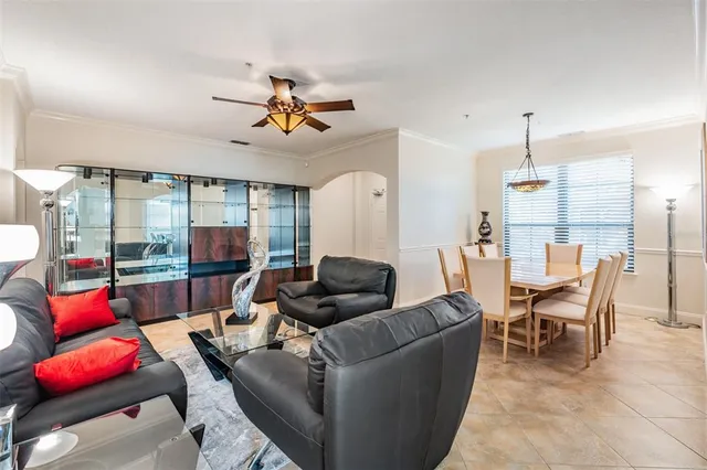 a living room with furniture a rug and a window