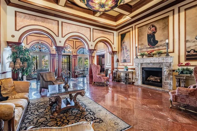 a dining room with furniture and a chandelier