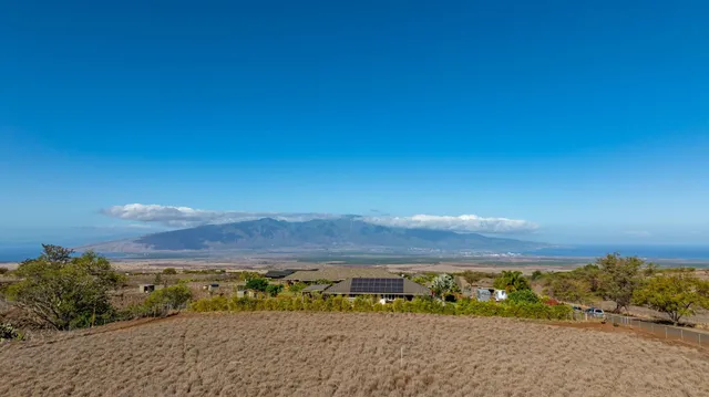a view of a road with a mountain in the background