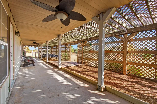 a kitchen with stainless steel appliances granite countertop a sink and wooden floors