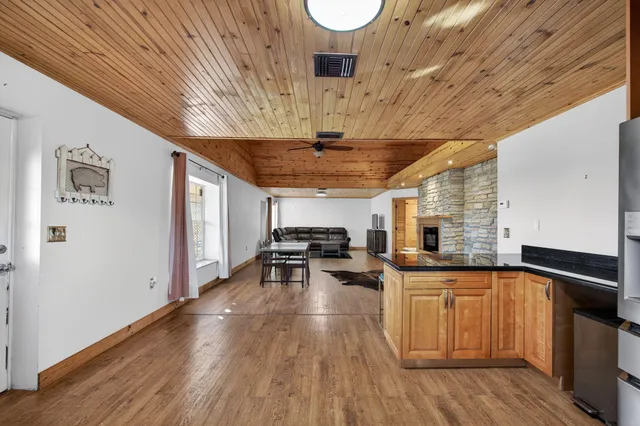 a room with wooden floor and window