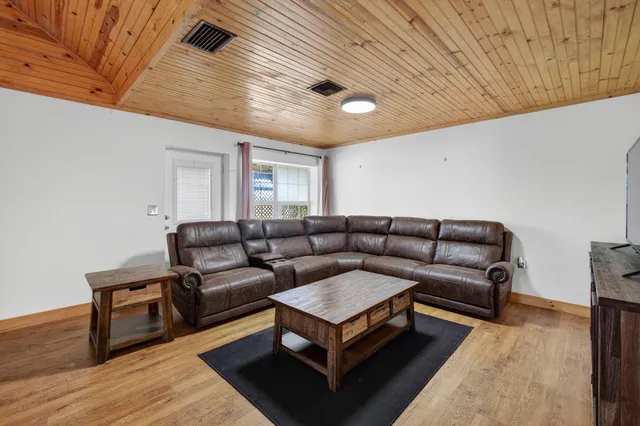 a room with a washing machine and a fireplace