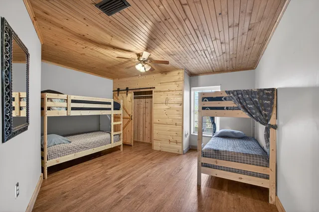 a view of a house with a yard and garage