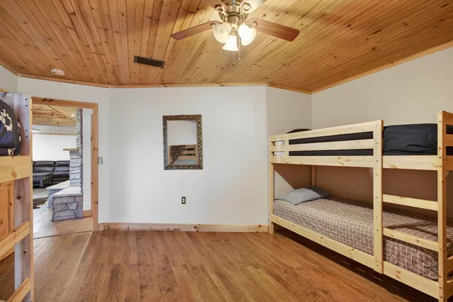 a view of a house with a patio and a yard