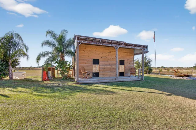a view of a porch with wooden floor and stairs