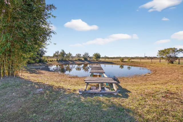 a view of an empty room with windows