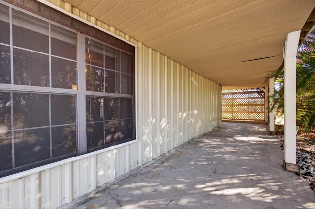 a view of a chairs and table in the balcony