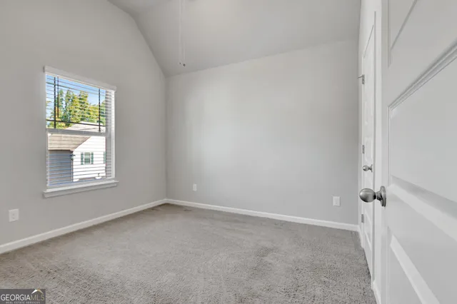 a spacious bathroom with a double vanity sink toilet mirror and bathtub