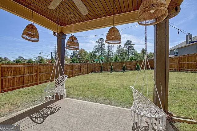 a front view of a house with outdoor seating