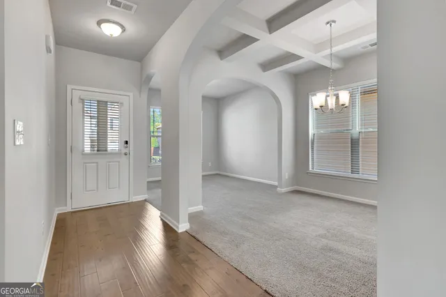 wooden floor in a hall with an entryway