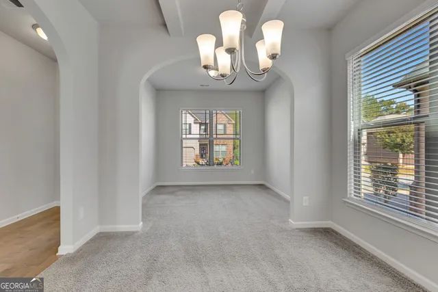 a view of a chandelier in a room with a chandelier
