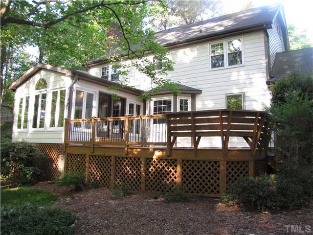 8304 Heel Stone Court Raleigh, NC 27613 - Photo 2 of 25 Enjoy the natural beauty of the yard from the deck and the sunroom. Exterior Back