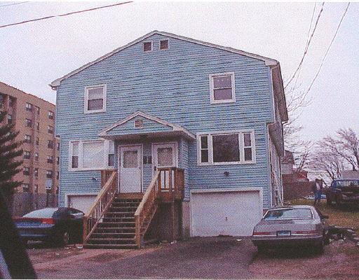 93 Shell Street Bridgeport, CT 06605 - Photo 1 of 1 a front view of a house with a yard