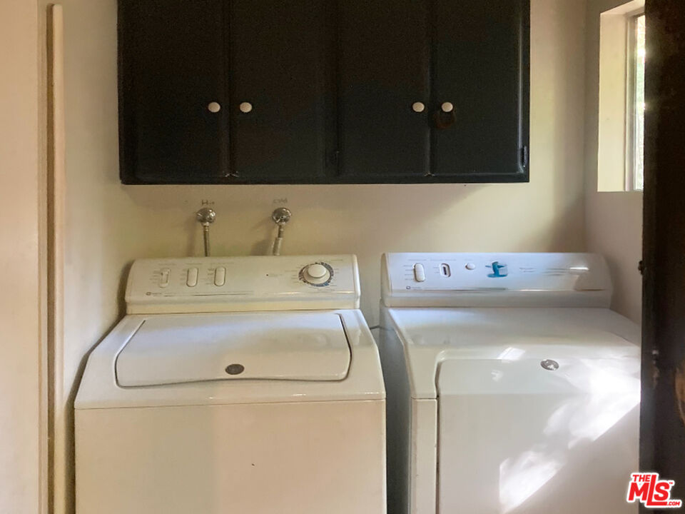 25614 Timpangos Drive Calabasas, CA 91302 - Photo 14 of 21 a utility room with a sink dryer and washer